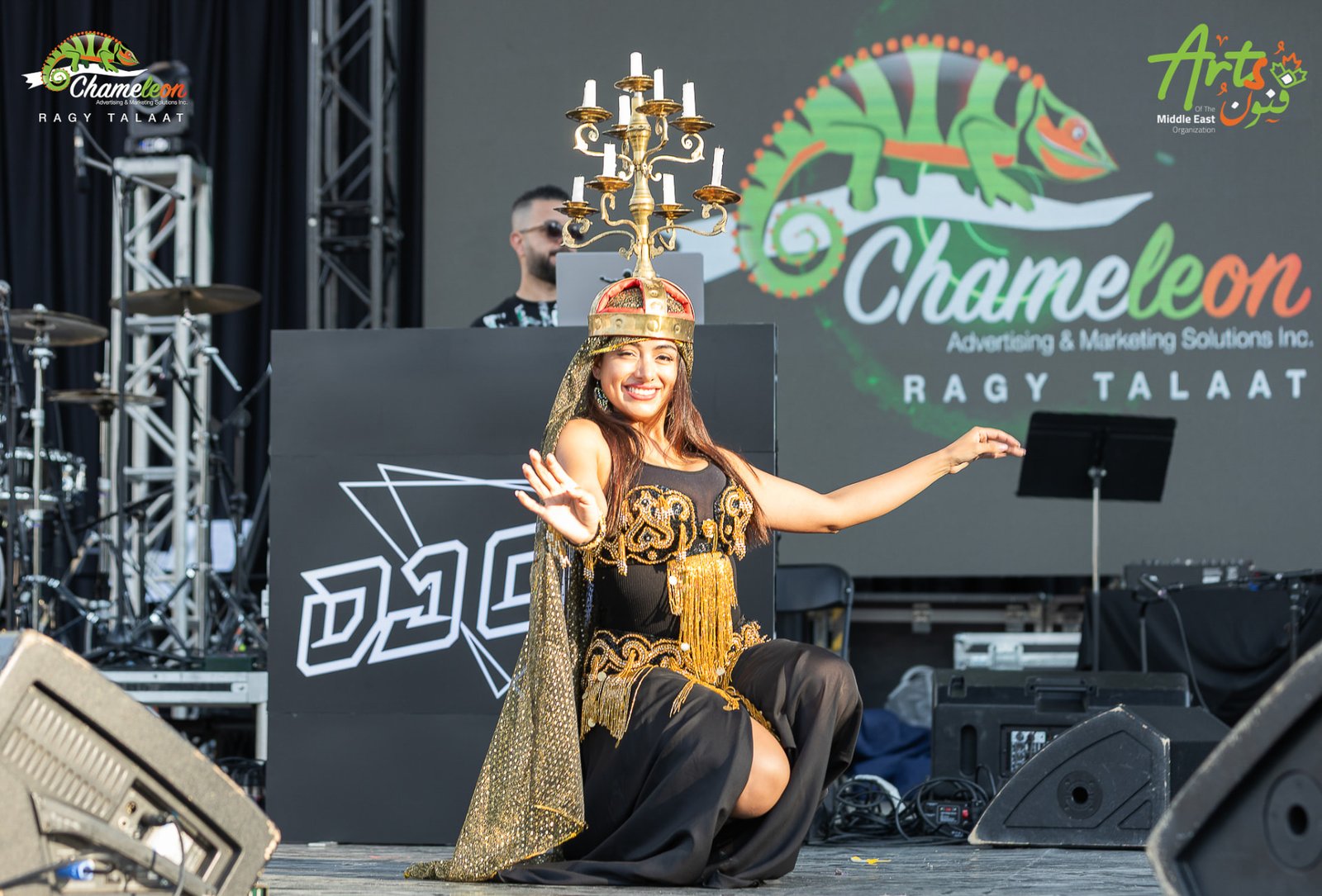 Dancer with a candelabra crown performing on the AMEF 2 stage