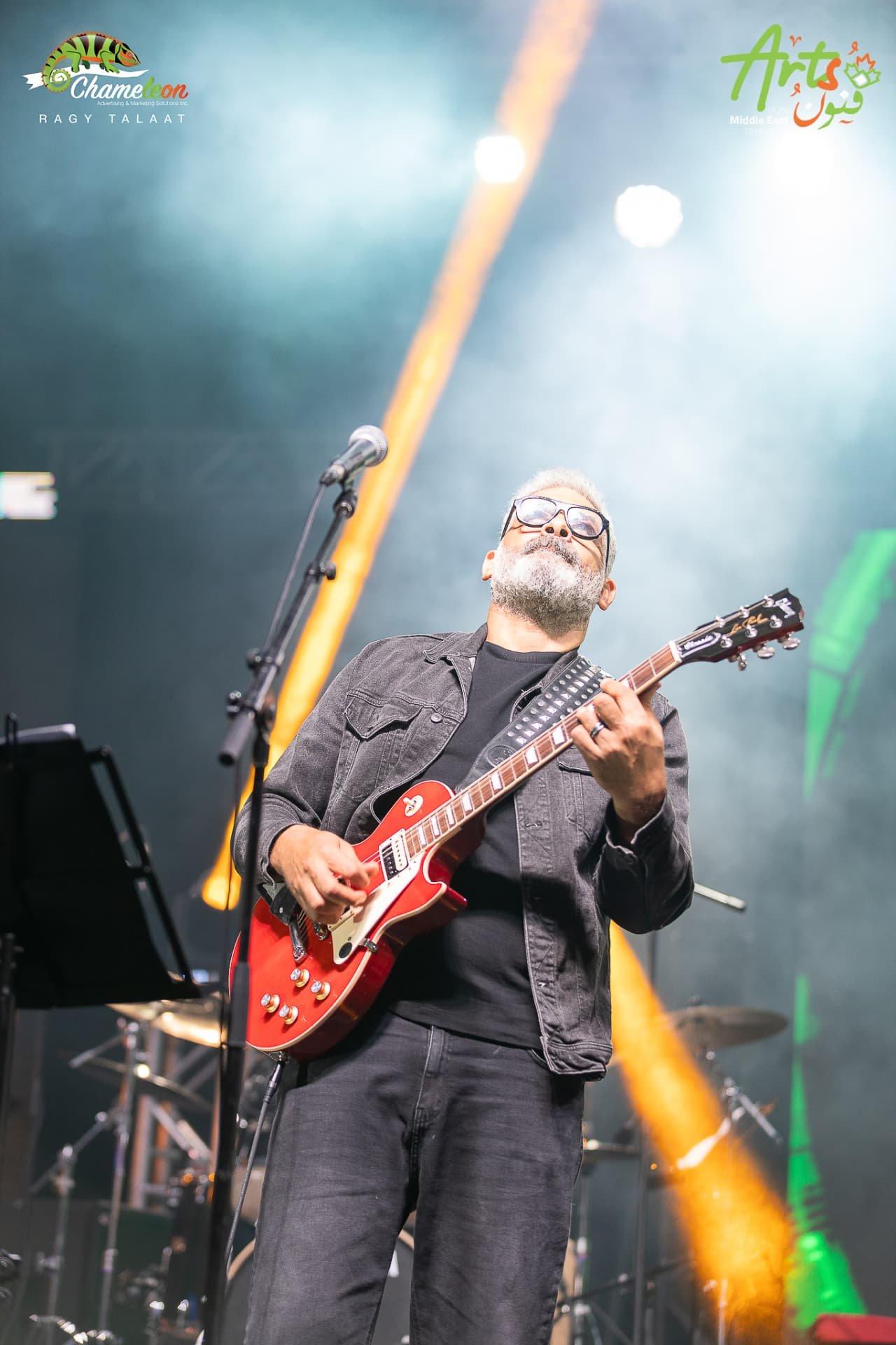 Guitarist under stage lights at AMEF 2