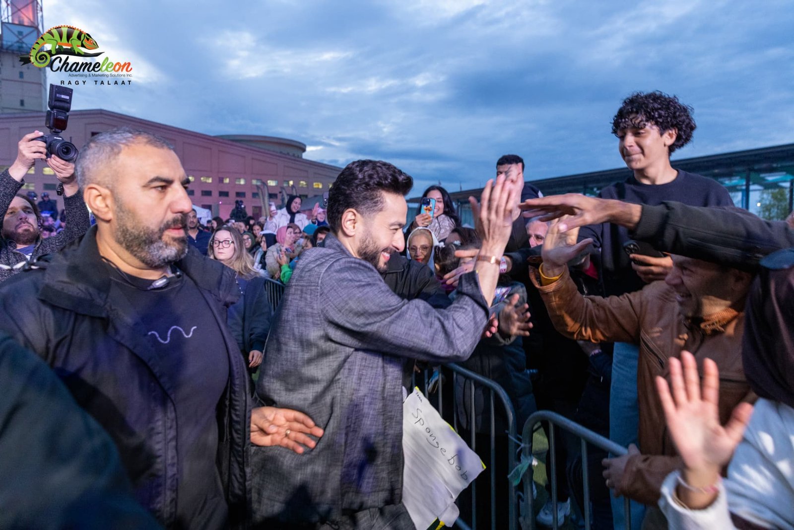 Hamada Helal greeting fans at the barrier — photo 18