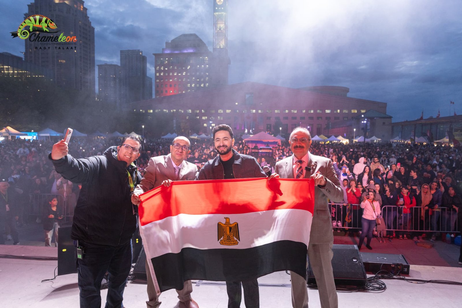 Hamada Helal on stage with organizers and the Egyptian flag — photo 21