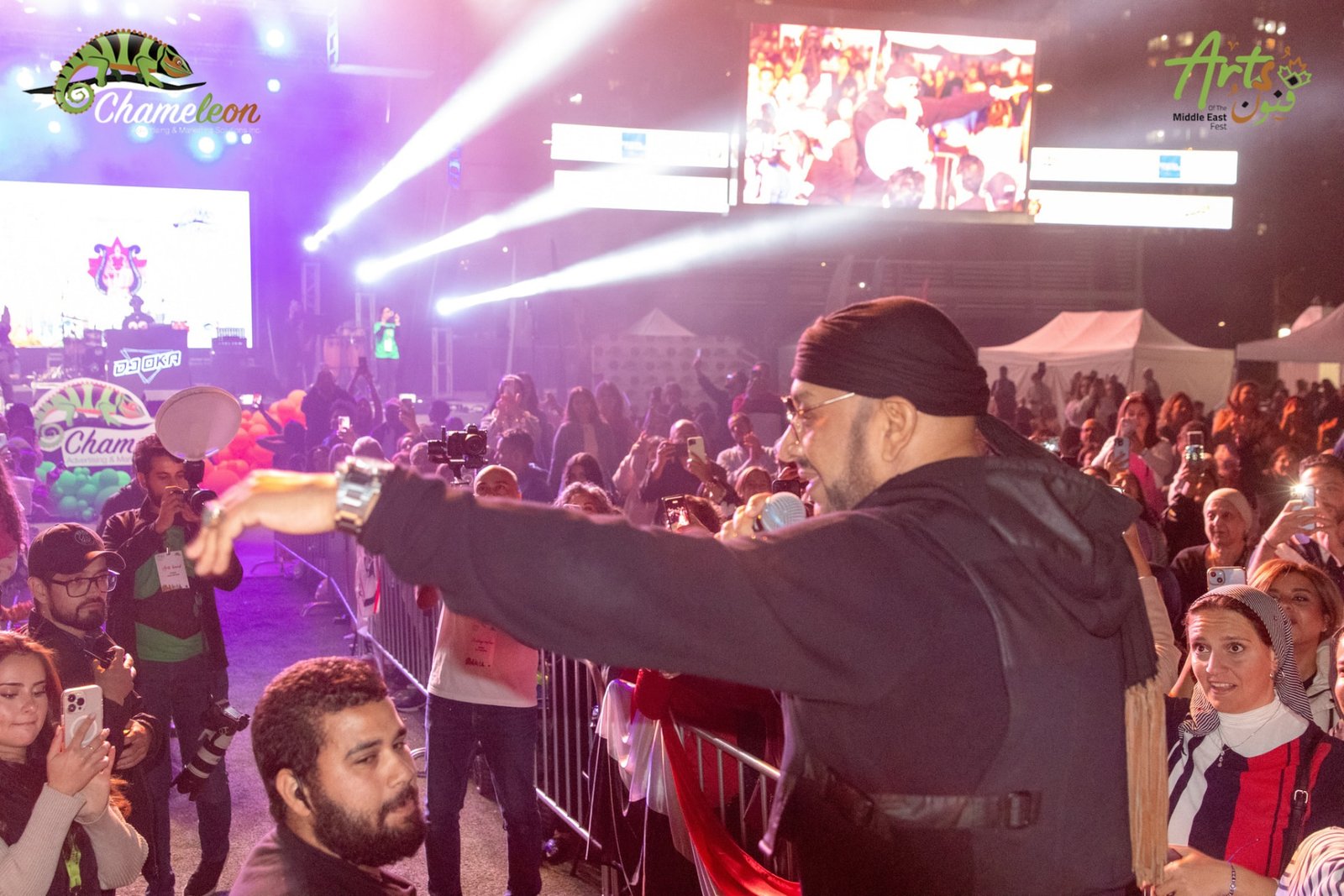Singer reaching out to the crowd at the barrier during MEF 1